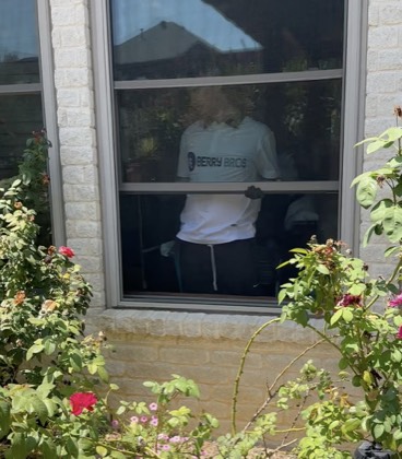 Interior window being cleaned by hand from inside the home