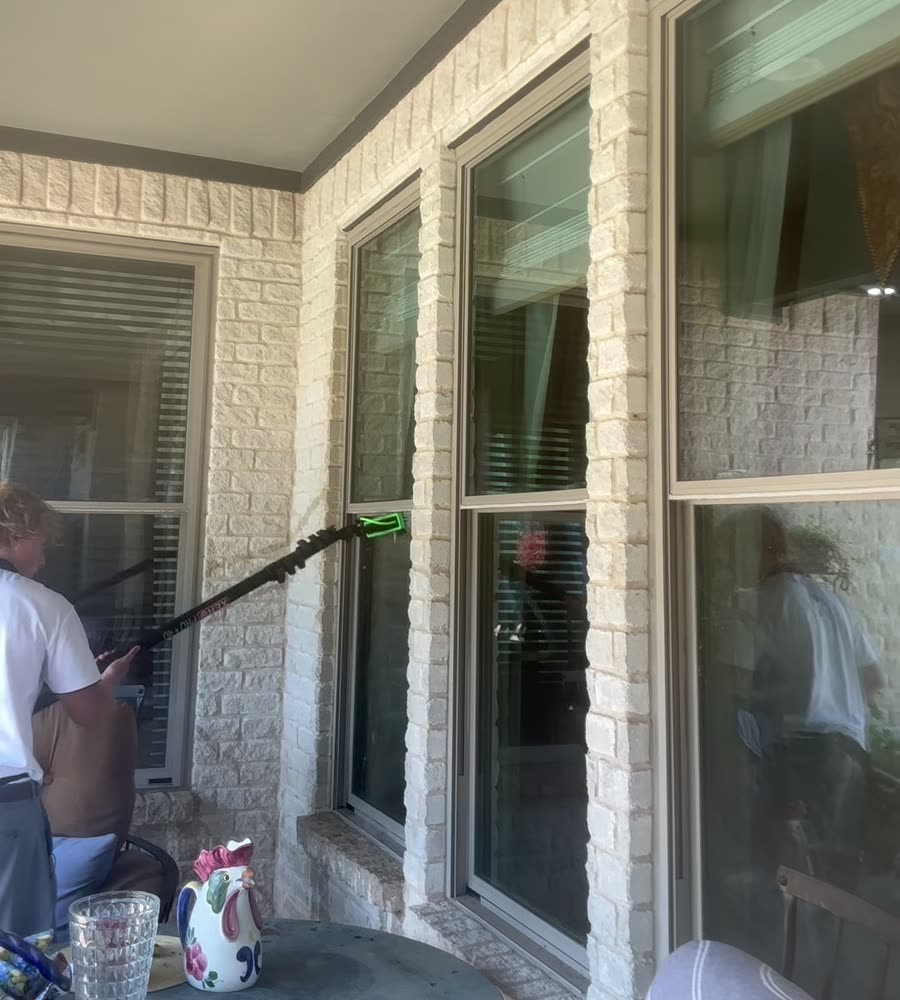 Window frames and tracks on a covered patio